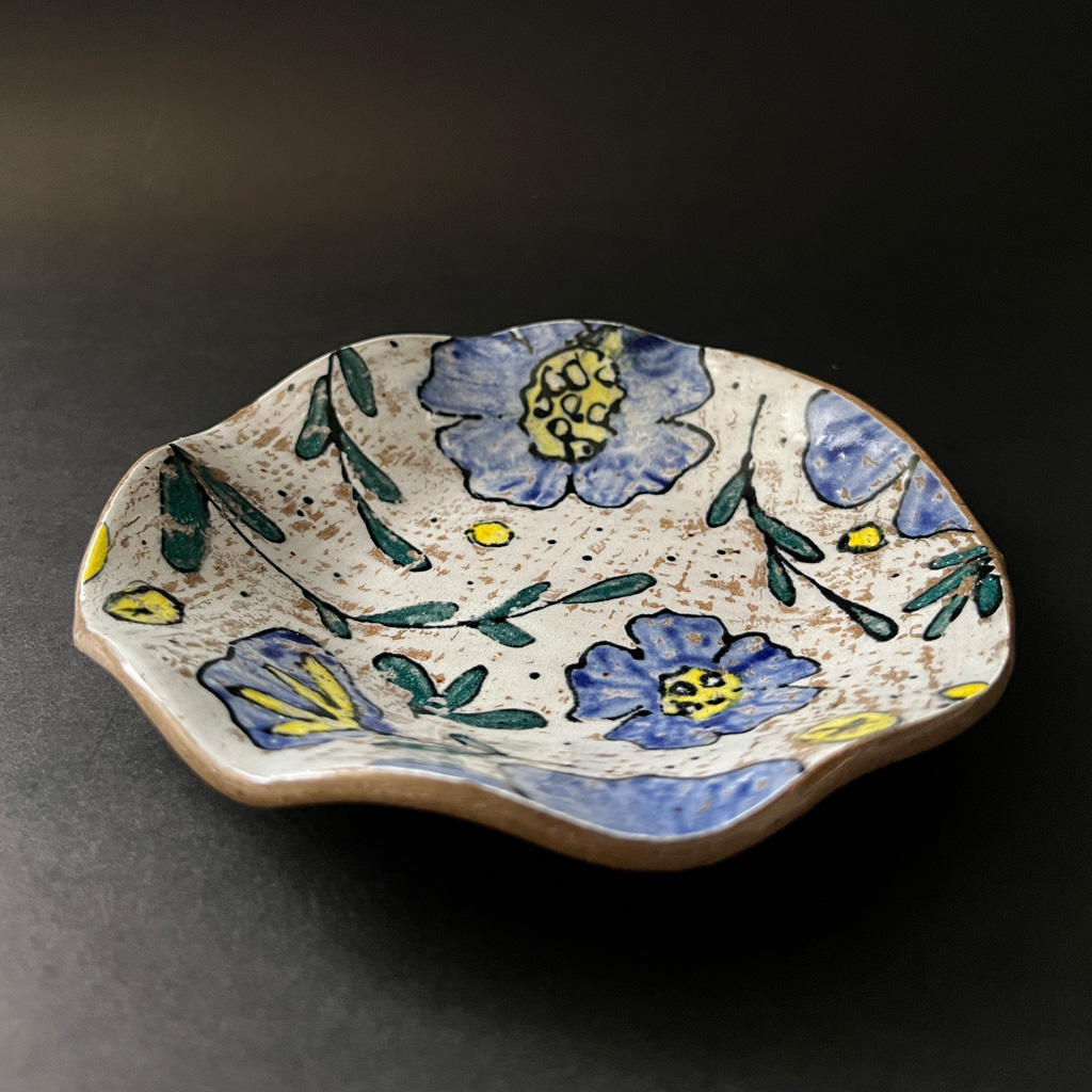 Pretty blue and yellow flowers monoprinted on red clay 5" wavy edged dish sheenahughespottery.com